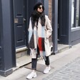 Model walking down street wearing Abstract Patterned Winter Scarf