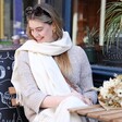 Smiling model wearing the Cream Cashmere Blend Scarf