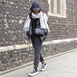 Model walking outside wearing Light Grey Cashmere Blend Scarf
