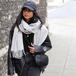 Female model wearing the Light Grey Cashmere Blend Scarf around neck