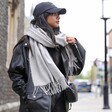 Model wearing Light Grey Cashmere Blend Scarf with leather jacket
