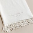 Close up of personalised detailing on the cream Personalised Embroidered Cashmere Blend Scarf