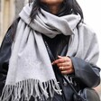 Close up of model wearing the grey Personalised Embroidered Initials Cashmere Blend Scarf