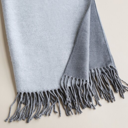 Close up of Two Tone Cashmere Blend Scarf in Grey against neutral coloured backdrop