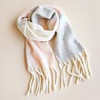 Light Pink and Grey Striped Winter Scarf on neutral coloured background