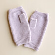 Lilac Hand Warmers on Beige Suface