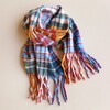 Mustard and Blue Tartan Winter Scarf on neutral coloured material