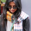 Mustard and Blue Tartan Winter Scarf on model looking down with sunglasses on