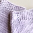 Close up of initial details on the Personalised Embroidered Hand Warmers in lilac