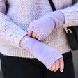 Model wearing the Personalised Embroidered Hand Warmers in lilac purple