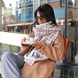 Model looking down wearing Personalised Initials Tan Tartan Winter Scarf