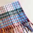 Close up of LD personalisation on Personalised Mustard and Blue Tartan Winter Scarf folded up on neutral backdrop