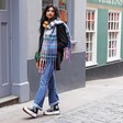 Model walking down street wearing Personalised Mustard and Blue Tartan Winter Scarf