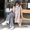 Tan Tartan Winter Scarf on Model Sitting on Bench 