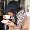 Tan Tartan Winter Scarf Scarf on Model Drinking Coffee