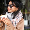 Tan Tartan Winter Scarf on Model Holding Mug