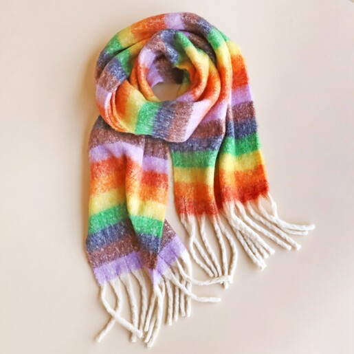 Vibrant Rainbow Striped Winter Scarf against neutral coloured background