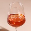 Close up of Personalised Birth Flower Wine Glass full of rose wine