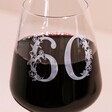 Close Up of Personalised Floral Milestone Birthday Wine Glass with 60 Personalisation Filled with Red Wine 