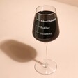 Personalised Measure Wine Glass full of red wine in front of pink background