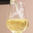 Close up of the Personalised Wine Glass with Name full of white wine