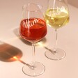 Two Full Personalised Wine Glass with Name on pink surface