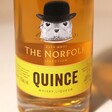 Close up of front of 500ml The English Distillery Norfolk Quince Whisky Liqueur bottle