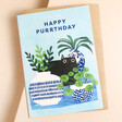 Happy Purrthday Birthday Card lying flat with a brown envelope