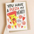 You Have A Pizza My Heart Valentine's Day Card on top of brown envelope on beige surface