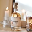 100ml Autumn Spiced Gin on top of wooden surface in front of mirror with glass