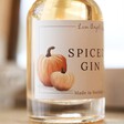 Close up of label on 100ml Autumn Spiced Gin in front of mirror