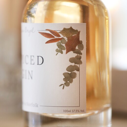 Side of label on 100ml Autumn Spiced Gin showing leaf details
