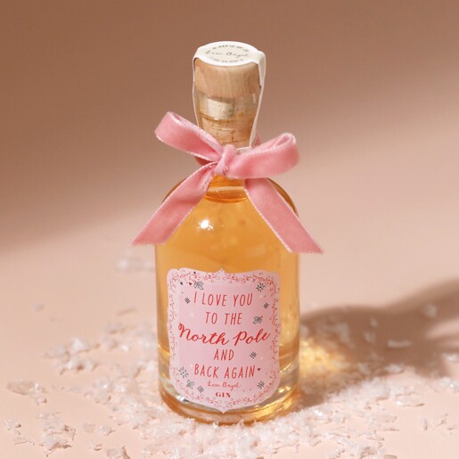100ml Love You To The North Pole Christmas Gin on Pink Surface With Snow
