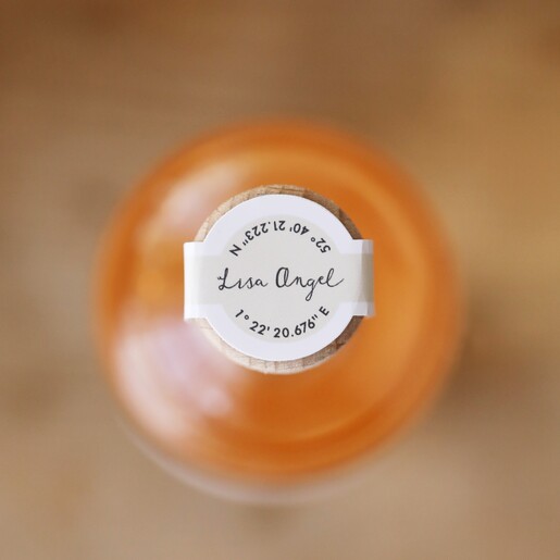 Top of 100ml Merry Christmas Spiced Gin on top of wooden counter