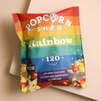 Rainbow Popcorn Snack Pack on pink surface