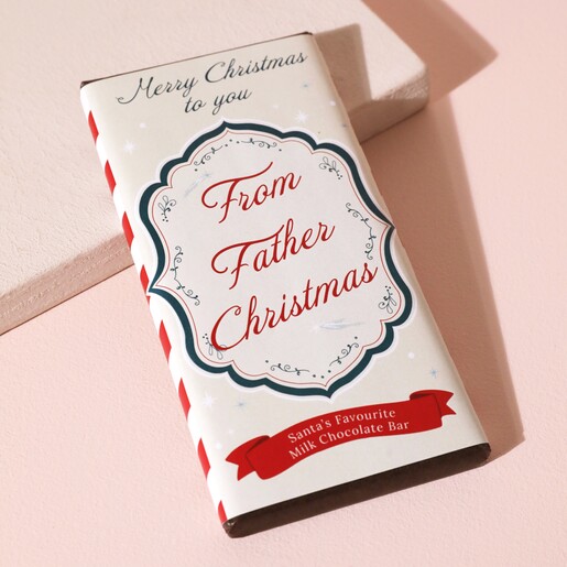 From Father Christmas Milk Chocolate Bar on beige background