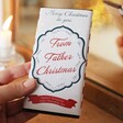 Model holding From Father Christmas Milk Chocolate Bar in lifestyle shot
