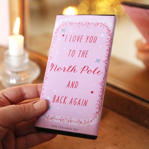 Model holding Love You To The North Pole Milk Chocolate Bar in lifestyle shot