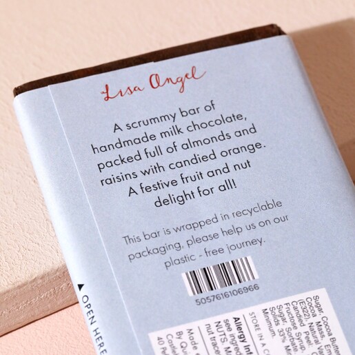 Back of Tastes Like Christmas Almond Raisin and Orange Milk Chocolate Bar packaging showing text