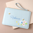 Personalised Floral Bee Accessory Bag in blue against neutral coloured background