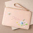 Personalised Floral Bee Accessory Bag in pink on top of beige surface