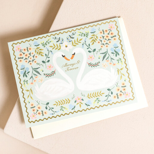 Rifle Paper Co. Always and Forever Swan Greetings Card on top of beige coloured envelope