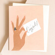 Rifle Paper Co. Congrats Ring Greetings Card Laying on Envelope On Beige Surface