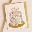 Rifle Paper Co. Layer Cake Birthday Card on Envelope on Beige Surface