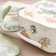 Close up of handle on Personalised Sass & Belle Desert Dino Tea for Two Set with contents out of case