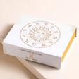 Gemini Zodiac Gemstone Set in closed box on top of beige backdrop