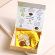 Gemini Zodiac Gemstone Set open with gemstones on top of cloth bag on top of neutral backdrop