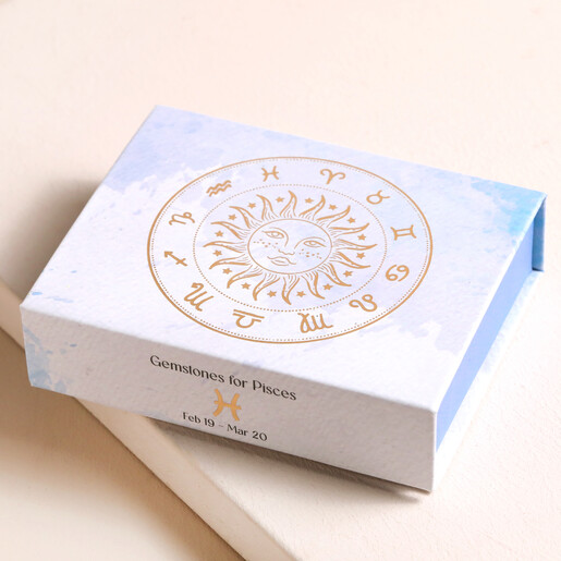 Pisces Zodiac Gemstone Set closed on top of beige backdrop