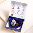 Taurus Zodiac Gemstone Set open with gemstones on top of cloth bag