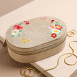 Embroidered Flowers Oval Jewellery Box on Beige Surface